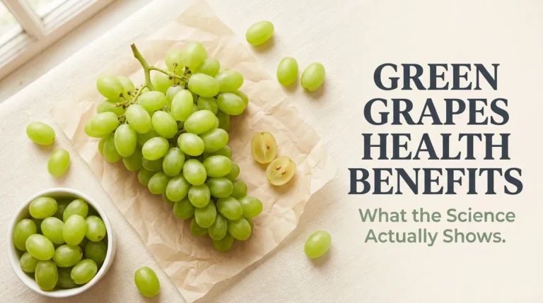 Overhead flat-lay of fresh green grapes with the Green Grapes Health Benefits headline displayed in bold text on a cream background.