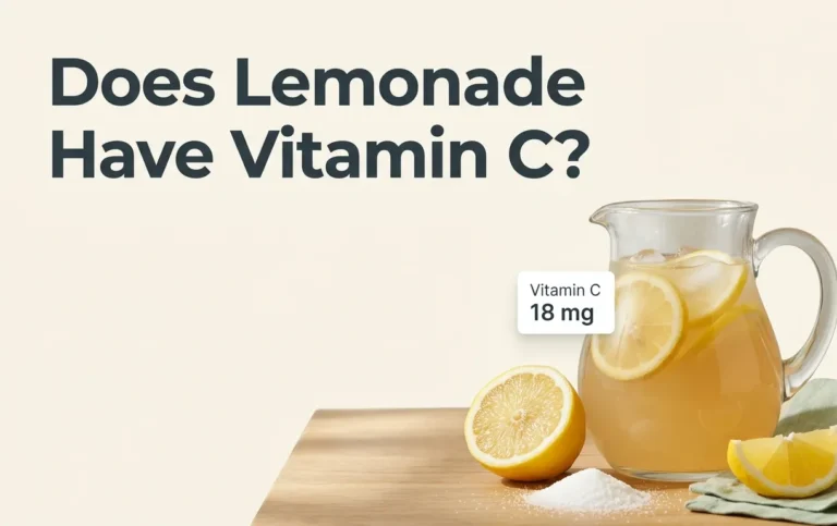 A pitcher of fresh lemonade with sliced lemons and a vitamin C nutritional overlay, titled Does Lemonade Have Vitamin C.